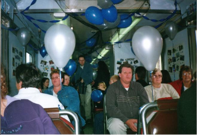 Happy party people aboard the chartered rail car